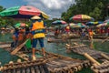 Tourists on bamboo rafts on Yulong River in Yangshuo