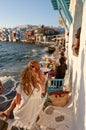 Tourists sitting in Mykonos waterfront bars