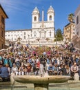 Tourists sitting in the spanish steps