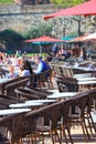 Tourists sitting on the terrace of a french cafe in Collioure, France