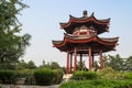 Tourists sitting under a Buddhist pagoda on the territory of the Giant Wild Goose Pagoda, Xian, China Royalty Free Stock Photo