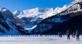 Tourists skating on Lake Louise winter ice skating rink. Banff National Park