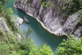 Tourists on the small boat, driving in the valley between the streams