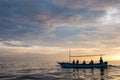 Tourists in small boats looking for dolphins in Lovina, Bali Royalty Free Stock Photo