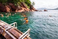 Tourists snorkeling at Red Rock island in Krabi province, Thailand.