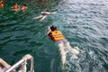 Tourists snorkeling at Red Rock island in Krabi province, Thailand.