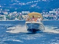 Tourists on a speed boat in the Kotor bay in Montenegro. Mountain, sea, nature Royalty Free Stock Photo