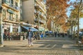 Tourists spend their time in the streets of Barcelona