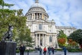 Tourists spending their time at St Paul`s Cathedral facade in London, England, United Kingdom