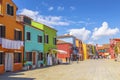 Tourists on the square with bright colorful houses on Burano island. Venice Royalty Free Stock Photo
