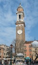 Tourists on square Campo Santi Apostoli and view of clock tower of the Church of the Holy Apostles of Christ, San Apostoli in Veni Royalty Free Stock Photo