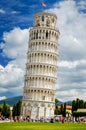 Tourists on Square of Miracles visiting Leaning Tower in Pisa, Italy. Royalty Free Stock Photo