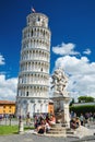 Tourists on Square of Miracles visiting Leaning Tower in Pisa, Italy. Royalty Free Stock Photo