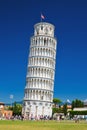 Tourists on Square of Miracles visiting Leaning Tower in Pisa, Italy. Royalty Free Stock Photo