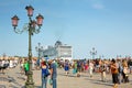 Tourists at St. Mark's Square in Venice, and cruise ship MSC Preziosa