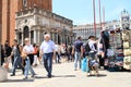 Tourists and stall in front of Tower Campanile di San Marco