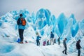 Tourists stand on the slopes of the glacier. Shevelev.