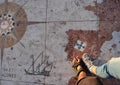 Tourists standing on a map in front of the Monument to the Discoveries Padrao dos Descobrimentos in Belem, Lisbon, Portugal