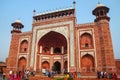 Tourists standing near Darwaza-i-Rauza Great Gate in Chowk-i J