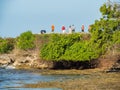 Tourists standing on reef in Benoa Bali