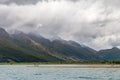 Tourists standing on the shore of Dart River in Glenorchy, New Zealand Royalty Free Stock Photo