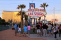 Tourists standing by Welcome to Fabulous Las Vegas sign, Nevada Royalty Free Stock Photo