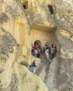 Tourists on the steps in goreme museum. Royalty Free Stock Photo