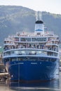 Tourists in the stern of a cruise ship in port Royalty Free Stock Photo