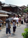 Tourists in the stone-paved roads of Ninenzaka and Sannenzaka in Kyoto. Royalty Free Stock Photo