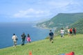 Tourists stop to take in view at Seacliff outlook overlooking New South Wales coast and distant cantilever road