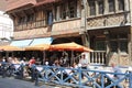 Tourists in street restaurant in Etretat town