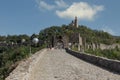 Tourists stroll along a brick walkway near Tsarevets fortress in Tarnovo, Bulgaria