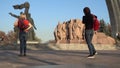 Tourists stroll near the monumental composition Arch of Friendship of Peoples in Kiev