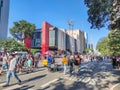 Tourists strolling along Paulista Avenue with the (MASP) Museum of Art of SÃÂ£o Paulo in the background.