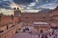 Tourists strolling at Amer Fort or Amber Fort courtyard at sunset