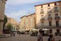 Tourists strolling in the central square of the french city of Pezenas, France