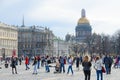 Tourists are strolling on Palace Square, St. Petersburg, Russia