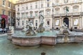 Tourists are strolling at the sunset in a Piazza Navona in city of Rome, Italy