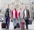 Tourists with suitcases and camera walk in Barcelona Royalty Free Stock Photo