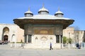 Tourists by Sultan Ahmet III Fountain in Istanbul