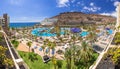 TAURITO, GRAN CANARIA, SPAIN - APRIL 23, 2016: Tourists on sun holidays at the Lago Taurito aquapark in Taurito, Gran Canaria. Ta