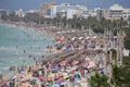 Tourist sunbathe or bath on the sea in crowded El Arenal beach in Mallorca Royalty Free Stock Photo