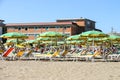 Tourists sunbathe on beach in Bellaria Igea Marina, Rimini