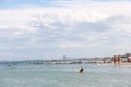 Tourists sunbathe on beach in Bellaria Igea Marina, Rimini