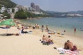 Tourists sunbathe at the Stanley town beachin Hong Kong, China.