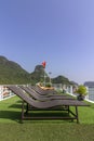 Tourists sunbathing in boat rooftop at Ha Long Bay Descending Dragon Bay popular tourist destination in Asia.