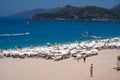 Tourists sunbathing and swimming on the Belcekiz (Belcegiz) Beach in Oludeniz