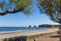 Tourists and surfers enjoy Hendaye beach in France. Royalty Free Stock Photo