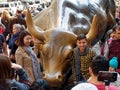 Tourists surrounding Wall Street Charging Bull Statue in Manhattan Financial District Royalty Free Stock Photo