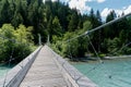 Tourists on the suspension bridge over the Rhine river in the Ruinaulta Gorge in the Swiss Alps Royalty Free Stock Photo